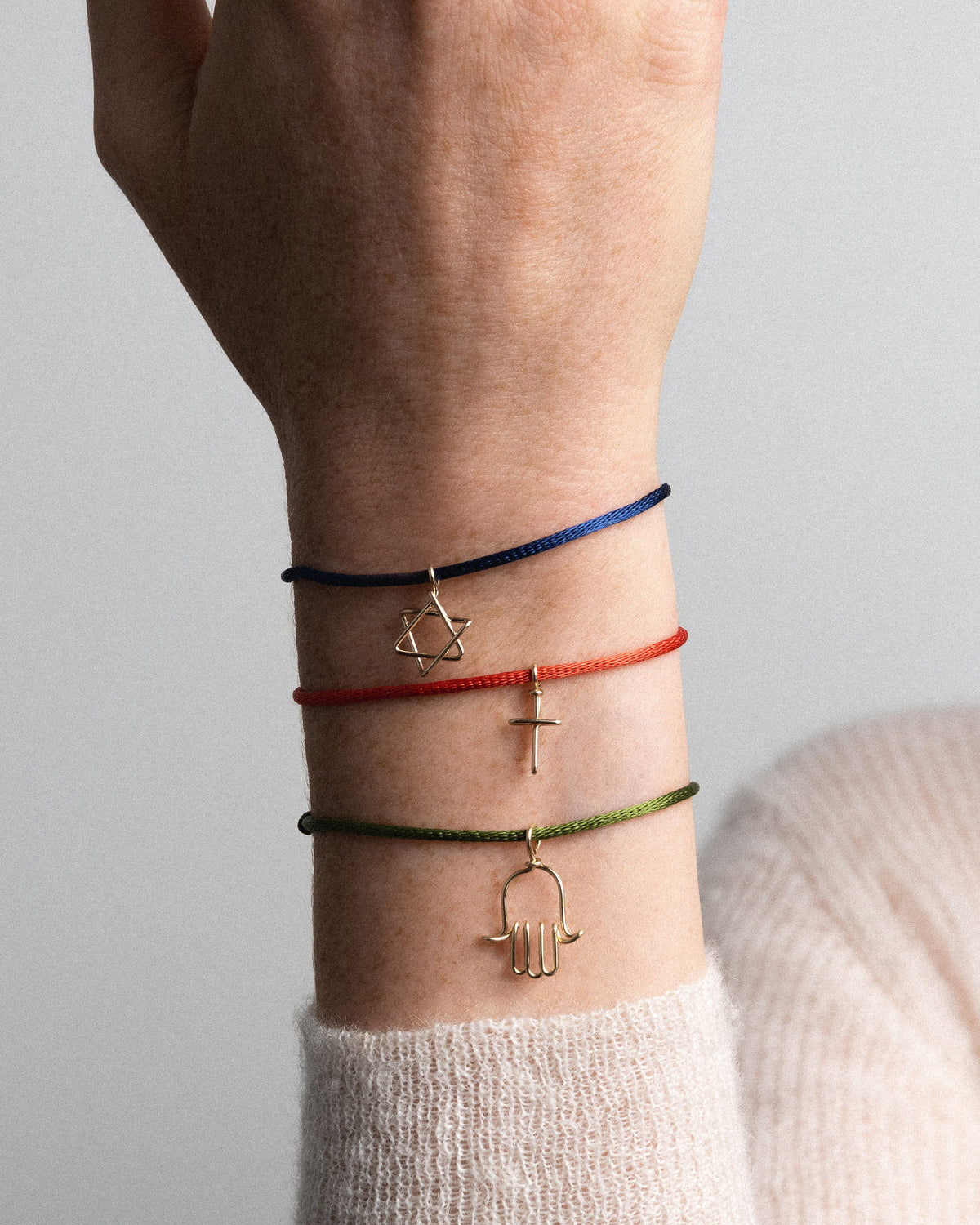 Symbolic Cross Charm Cord Bracelet